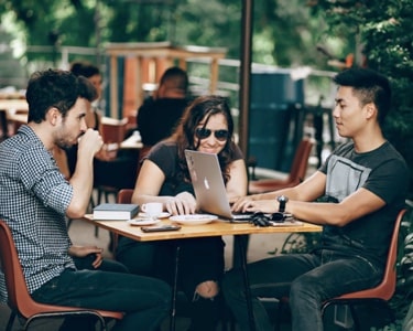 Teammembers of PayAPI team engaged in friendly chat